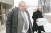 John Woods / Winnipeg Free Press 
Mark Stobbe (left), who has been charged with killing his wife, Beverly Rowbotham in 2000, leaves court Monday  in Winnipeg with his lawyer, Tim Killeen. The trial is expected to last two months.