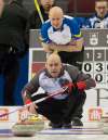 Adrian Wyld/ The Canadian Press
Team Alberta skip Kevin Koe looks over the shoulder of his brother, Team Northwest Territories skip Jamie Koe, Monday. Alberta&rsquo;s Koe defeated Manitoba&rsquo;s Mike McEwen 9-4 in the evening draw.