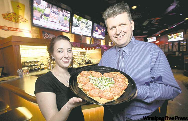 Mike Deal / Winnipeg Free Press
Caitlyn Fecyk and Andrew Shefchyk of Boston Pizza have noticed an increase in visits as of late.