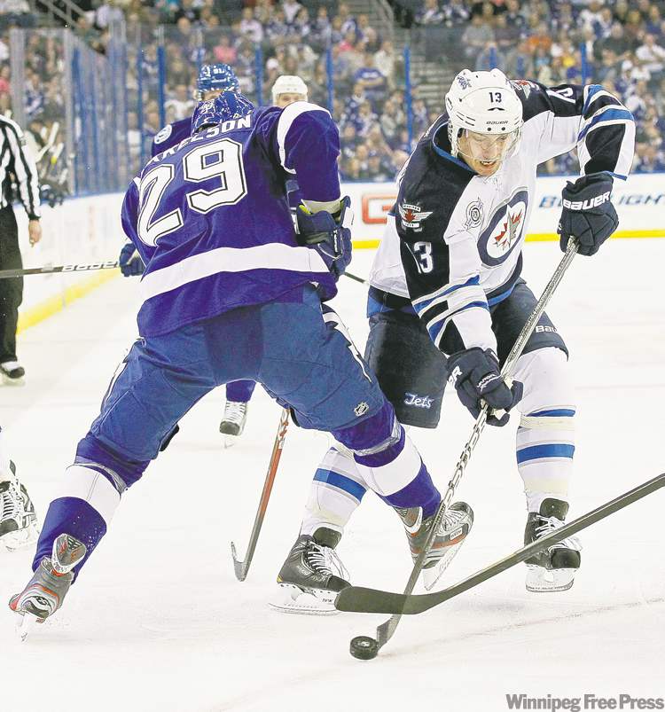 CP
Mike Carlson / the associated press
Tampa Bay�s Brendan Mikkelson (29) tries to slow up Winnipeg Jet Kyle Wellwood.