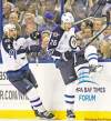 CP
Mike Carlson / the associated press
Blake Wheeler (26) celebrates his second-period goal with teammate  Zach Bogosian.