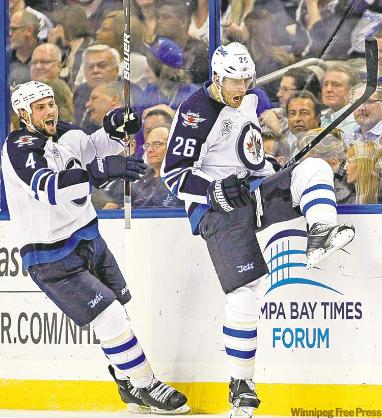 CP
Mike Carlson / the associated press
Blake Wheeler (26) celebrates his second-period goal with teammate Zach Bogosian.