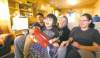 Ruth Bonneville / Winnipeg Free Press
Suzanne Martin (centre), with boyfriend Nathan Sutherland, nephew Hayden Scott and sister Tiffany Martin, in one of the traditional log houses being built on the Swan Lake reserve.