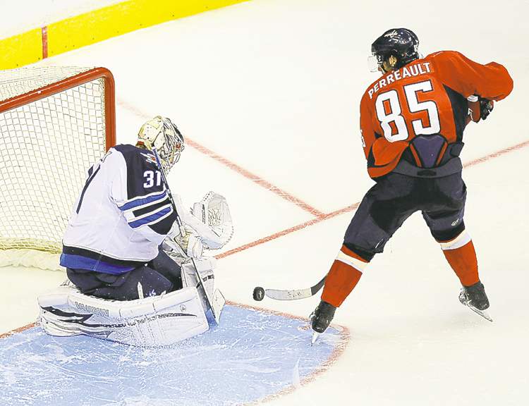 Tribune Media MCT
Chuck Myers / MCT
Jets goalie Ondrej Pavelec makes the winning save on Mathieu Perreault.