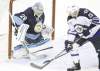 CP
Gene J. Puskar / the associated press
Winnipeg�s Kyle Wellwood puts a backhander past Penguins goalie Marc-Andre Fleury in the opening frame on Saturday.