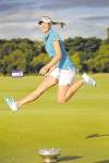 CP
Joe Castro / The Associated PressJessica Korda jumps for joy over her trophy.