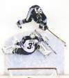 Gene J. Puskar / The Associated Press archives
Pittsburgh Penguin Evgeni Malkin swoops around Jets goalie Ondrej Pavelec to light the lamp on Saturday afternoon. Malkin added four assists to the cause in an 8-5 Pens victory.