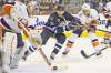John Woods / The Winnipeg Free Press 
Winnipeg Jet Blake Wheeler (26) drives for the puck as New York Islanders' goaltender Evgeni Nabokov clears it from harm's way on Tuesday.