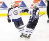 REUTERS
Eric Miller / reuters
Jets left-winger Evander Kane (9) is congratulated by teammate Tanner Glass after scoring the shootout winner against Minnesota on Thursday night.