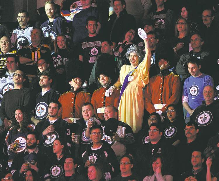 Fred Greenslade / reuters
Queen Elizabeth II makes an unexpected appearance at Friday night's Jets game. The winsome beauty graced the MTS Centre crowd with a wave of her elegantly gloved hand during the singing of the Canadian anthem.