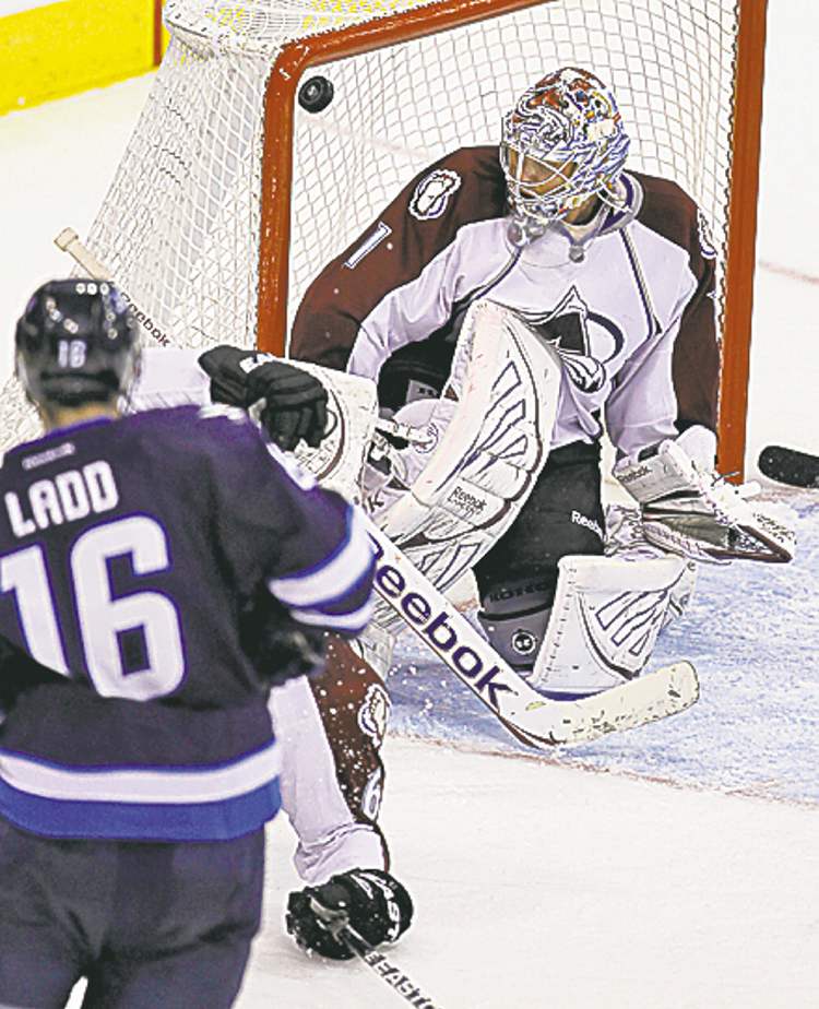 CP
.Ladd's goal sneaks over Varlamov's shoulder.