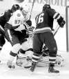 Phil Hossack / Winnipeg Free Press
Tampa Bay goalie Mathieu Garon peers through traffic while Matt Gilroy (97) and Winnipeg�s Andrew Ladd battle for possession in the first period.