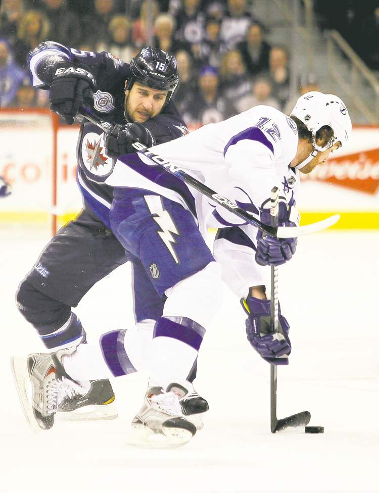 John Woods / the canadian press
Winnipeg Jets' Tanner Glass (15) has been around the block a few times. He's fully aware of the trade possibilities.