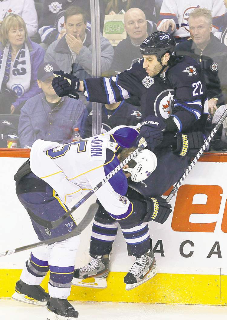 CP
John Woods / The Canadian Press
Winnipeg winger Chris Thorburn is levelled by St. Louis defenceman Barret Jackman.