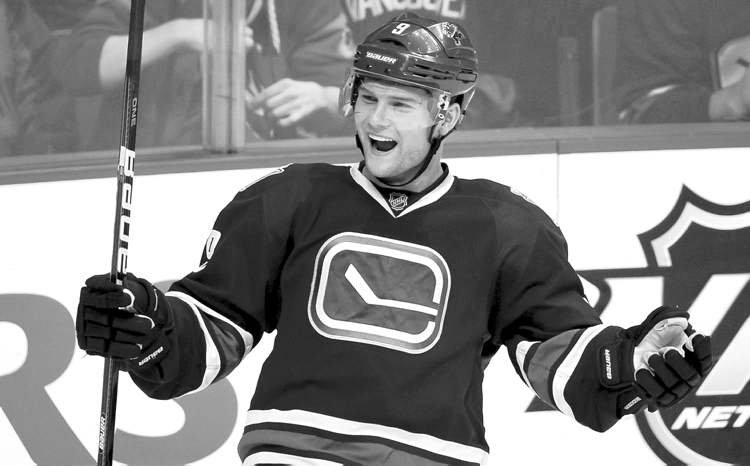 CP
Darryl Dyck / The Canadian Press Archives
Cody Hodgson celebrates a goal against the San Jose Sharks last month. The Canucks centreman goes to the Sabres for winger Zack Kassian.