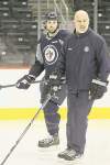 Mike Deal / Winnipeg Free Press 
Jets defenceman Zach Bogosian skates with assistant coach Charlie Huddy during optional skate on Tuesday.
