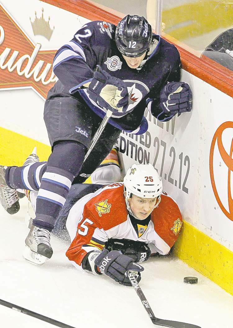 MIKE DEAL / WINNIPEG FREE PRESS
Mike Deal / Winnipeg Free Press
Jets� Randy Jones takes out Panthers� Jerred Smithson.