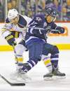 CP
Winnipeg Jets� Kyle Wellwood (13) and Buffalo Sabres� Patrick Kaleta (36) fight for the puck during second period NHL action in Winnipeg on Thursday, January 19, 2012. THE CANADIAN PRESS/John Woods
