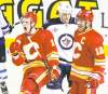 Stuart Gradon /  postmedia news
The Flames' Matt Stajan (left) celebrates scoring against the Jets with teammate Jarome Iginla in the first period Friday in Calgary.