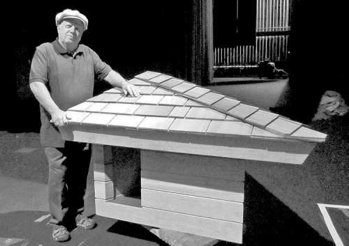 CP
Alisse Gratehouse / The Associated Press Jim Berger poses next to a doghouse designed by Frank Lloyd Wright in Glendale, Calif.