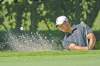 CP
Phelan M. Ebenhack / the associated pressTiger Woods hits out of a bunker on the first hole at the Arnold Palmer Invitational Thursday. No sign of Achilles trouble.