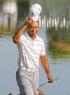 Joe Skipper / reuters
Tiger Woods fired a 7-under 65 for a share of the lead with Charlie Wi.