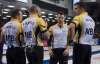 Adrian Wyld / The Canadian Press
Team Manitoba lead Denni Neufeld, third B.J. Neufeld, skip Mike McEwen and second Matt Wozniak talk during round robin competition against Team Northern Ontario at the Brier curling championship Thursday.