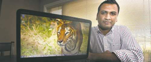Phil Hossack / Winnipeg Free Press
Sanjeev Reddy with a photo taken by his wife during a recent visit to a wildlife sanctuary in India.