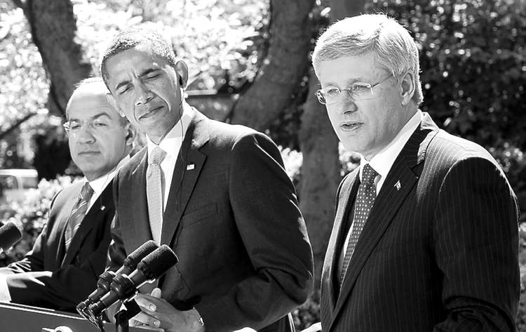 CP
Paul Chiasson / THE CANADIAN PRESS
Prime Minister Stephen Harper delivers a statement in the Rose Garden as U.S. President Barack Obama and Mexican President Felipe Calder��n listen.