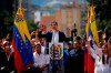 Juan Guaido, head of Venezuela's opposition-run congress, declares himself interim president of Venezuela, during a rally demanding President Nicolas Maduro's resignation in Caracas, Venezuela, Wednesday, Jan. 23, 2019. (AP Photo/Fernando Llano)