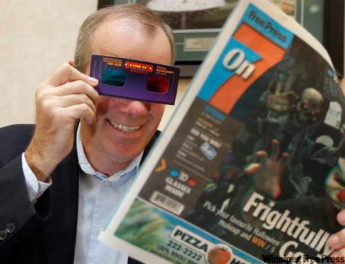 Ruth Bonneville / Winnipeg Free Press
Winnipeg Free Press Publisher Bob Cox uses 3-D glasses to read a prototype of Sunday's On7 paper which will be printed in 3-D.