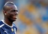 Italy’s Mario Balotelli smiles during a training session ahead of Sunday's Euro 2012 soccer championship final between Spain and Italy in Kiev, Ukraine, Saturday, June 30, 2012. (AP Photo/Darko Vojinovic)