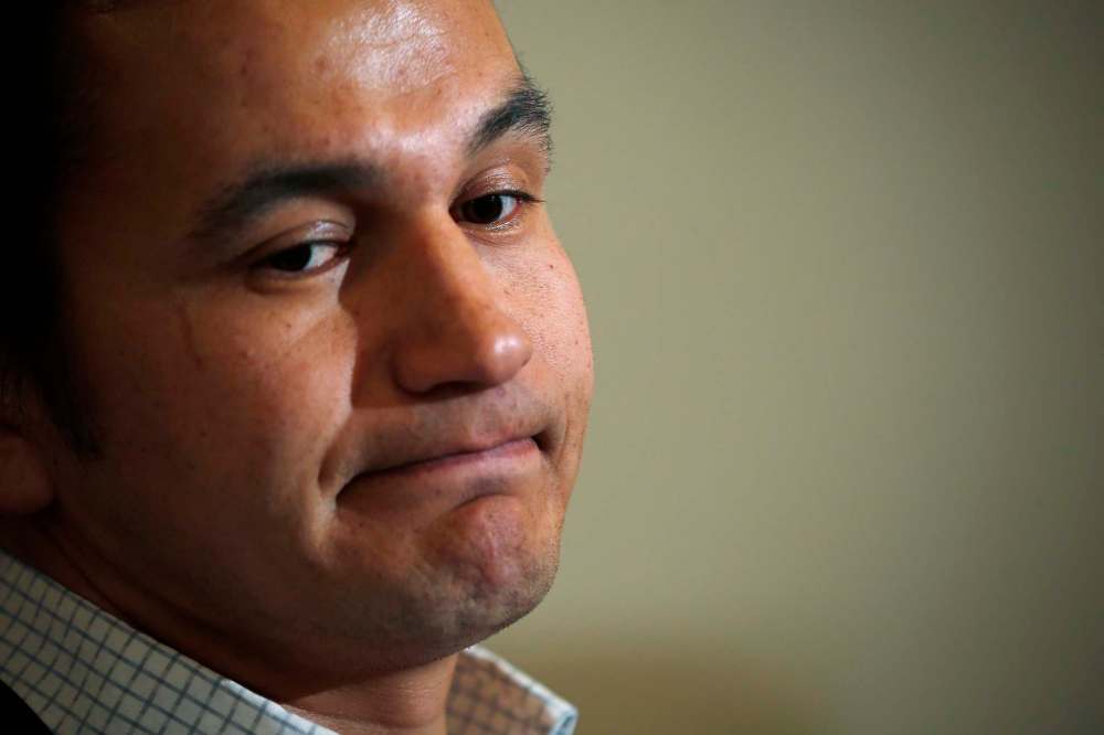 John Woods
/ The Canadian PressWab Kinew, Manitoba NDP candidate for Fort Rouge, listens as Premier Greg Selinger responds at a news conference in Winnipeg, Friday, March 11, 2016 to Liberal party allegations of “hurtful” tweets of Wab Kinew’s which have surfaced online.