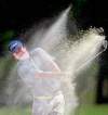 Gerald Herbert / The Associated Press
Jason Dufner hits out of a sand trap on the second hole Saturday in the third round of the Zurich Classic at the  TPC Louisiana course in Avondale, La.