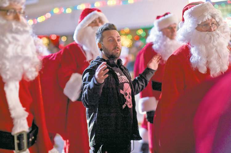 rebecca sandulak photos
Santa Claus-trophobic: Director Steven C. Miller is surrounded by Kris Kringles.