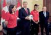 CP
Sean Kilpatrick / the canadian pressPrime Minister Stephen Harper readies for a throw-in Friday after it is announced Canada will host the 2015 Women�s World Cup. Far right is FIFA�s Sepp Blatter.