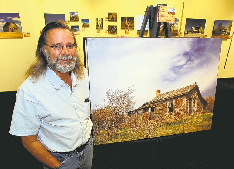 Winnipeg Free Press
BORIS MINKEVICH / WINNIPEG FREE PRESS
Wayne Benedet with some of his work now on display at Steinbach�s Mennonite Heritage Village Museum gallery.