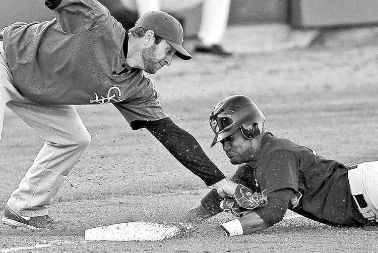Winnipeg Free Press
photos by John Woods / Winnipeg Free Press
Winnipeg Goldeyes� Price Kendall beats the tag from the St. Paul Saints third baseman during an exhibition game Tuesday at Shaw Park.