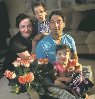 Phil Hossack / Winnipeg Free Press
Hani Al-Ubeady with wife Mernisa and their Canadian-born kids Benamru, 4, and Mina, 3. 'I'm not saying I'd hate to be rich, but there's a component of satisfaction and contentment you get from living here.'