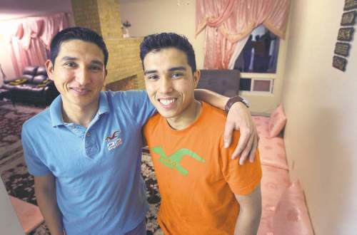 JOE BRYKSA / WINNIPEG FREE PRESS 
Kahlid Hassani (left, with his brother Qayum), works two jobs, goes to school full time and supports his mother and five siblings -- but he still finds his life here to be a piece of cake compared to growing up in Afghanistan. He won Winnipeg's Youth Role Model Award for courage.