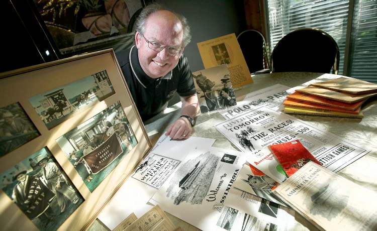 Phil Hossack / Winnipeg Free Press
Assiniboia Downs' historian Bob Gates at home with some of his large collection of track memorabilia. Gates has been a racing fan since he can remember.