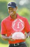 Tribune Media MCT
brooke lavalley / columbus dispatchTiger Woods holds his winner�s trophy at the Memorial Tournament on Sunday at Muirfield Golf Club in Dublin, Ohio.