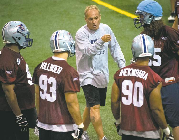 Peter McCabe / postmedia news ARCHIVES
Ex-Bomber head coach Jeff Reinebold, now defensive co-ordinator in Montreal, gives pointers at Alouettes training camp in Sherbrooke, Que.