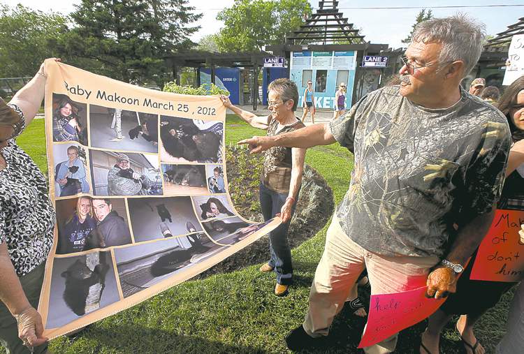 Phil Hossack / Winnipeg Free Press
Rene Dubois gestures to a photo quilt his family made of Makoon's stay with them.