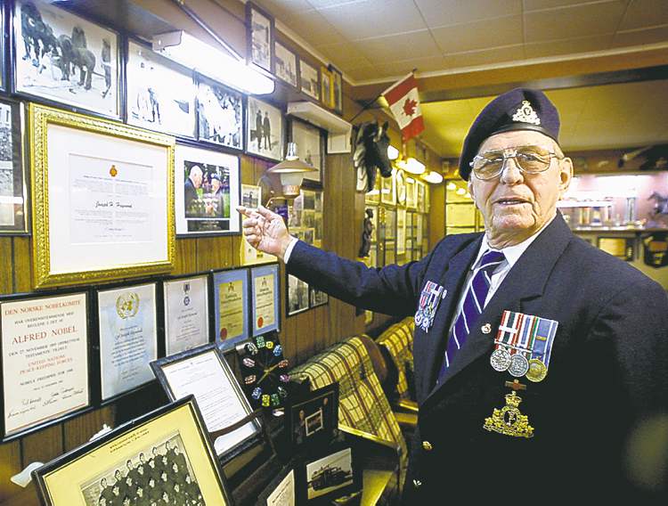 MIKE DEAL / WINNIPEG FREE PRESS archives
Joe Haywood shows his many photos and awards in his basement.