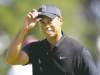 Ben Margot / the associated press
Tiger Woods tips his hat after making a birdie Friday on the 10th hole at the Olympic Club.