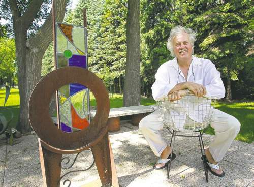 Artist and architectural interior designer Ben Wasylyshen with one of his sculptures, titled Summer Garden Portal. 'We were growing up Canadian and playing hockey on the street... but we were raised under an umbrella of this other culture.'
