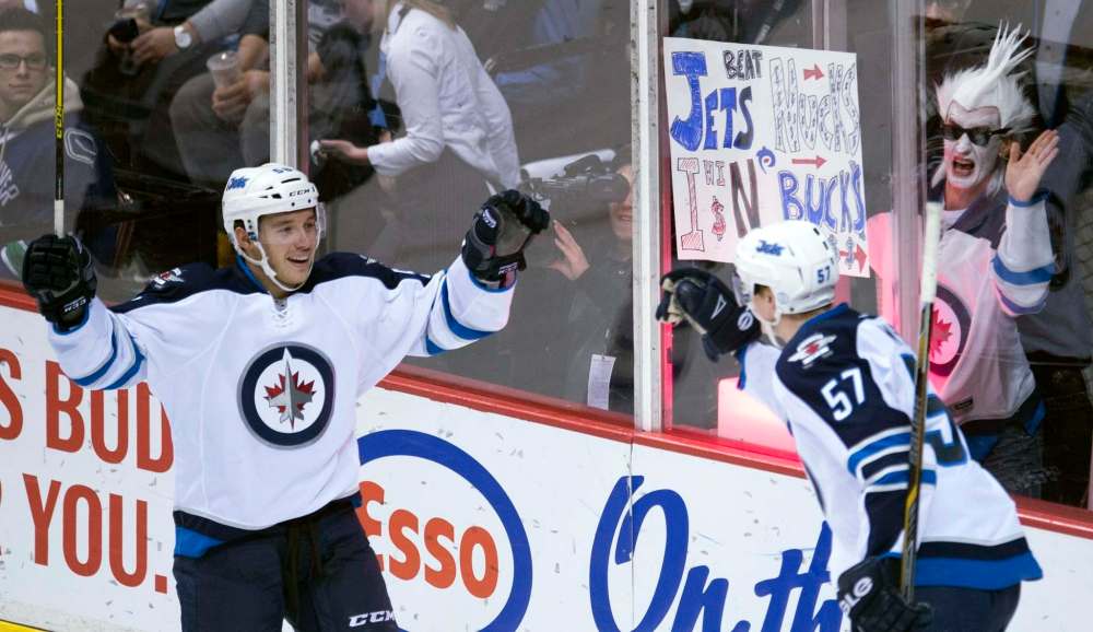 Jonathan Hayward / The Canadian Press
Winnipeg Jets Marko Dano (left) celebrates his goal with teammate Tyler Myers (57) during first period NHL action against the Vancouver Canucks in Vancouver on Monday night.