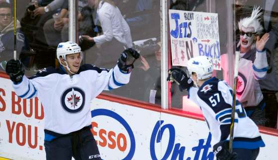Jonathan Hayward / The Canadian PressWinnipeg Jets Marko Dano (left) celebrates his goal with teammate Tyler Myers (57) during first period NHL action against the Vancouver Canucks in Vancouver on Monday night.