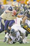CP
John Woods / the canadian press
Blue Bombers QB Buck Pierce escapes a tackle attempt by Hamilton�s Brandon Boudreaux on Wednesday night.